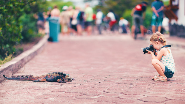 Child photographing wildlife in the Galapagos